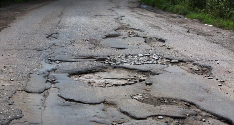 Warm weather leads to more potholes, larger cracks in roads