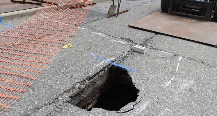 8-foot void beneath road closes part of US-12 in downtown Ypsilanti